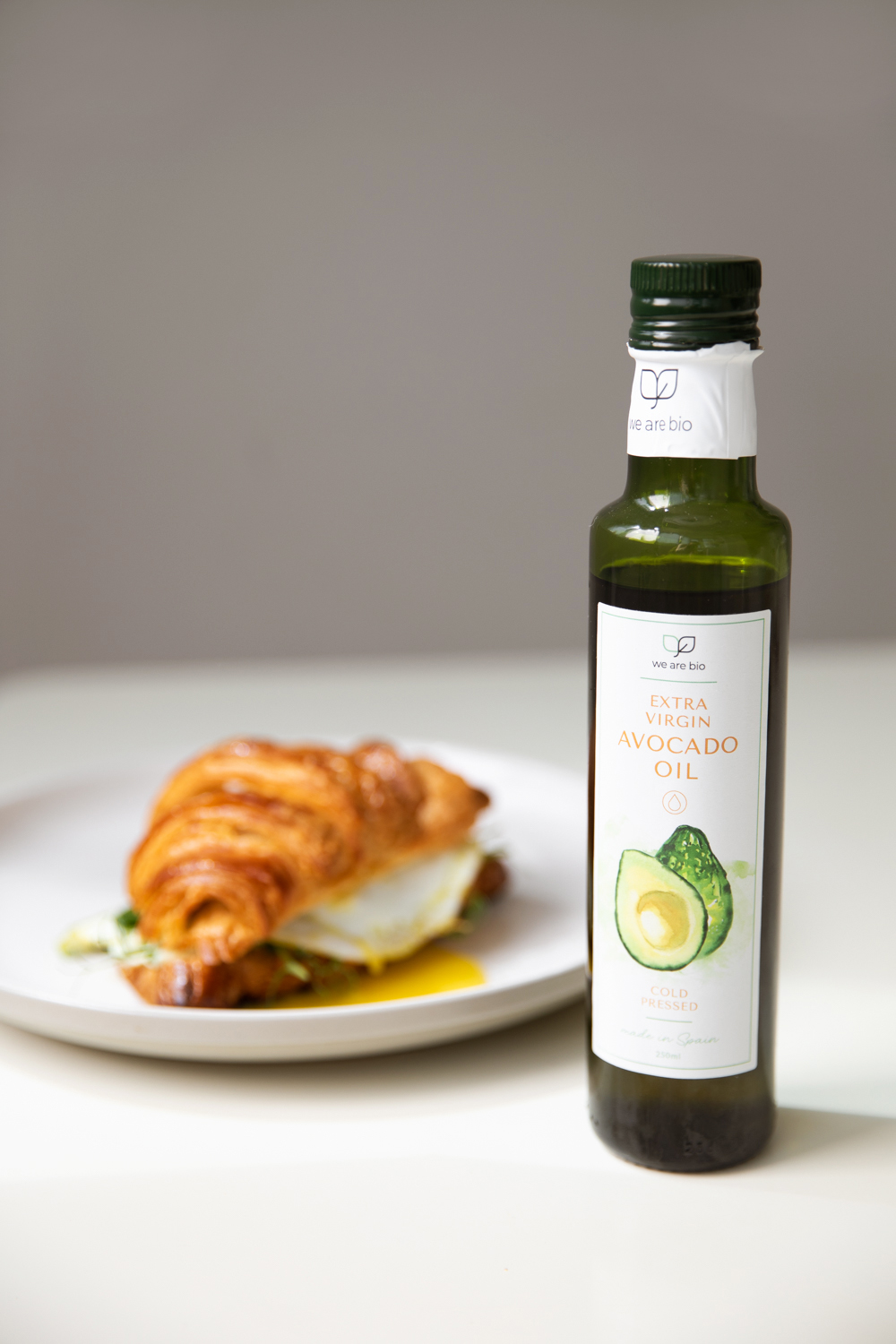 Avocado oil drizzled over a fresh croissant