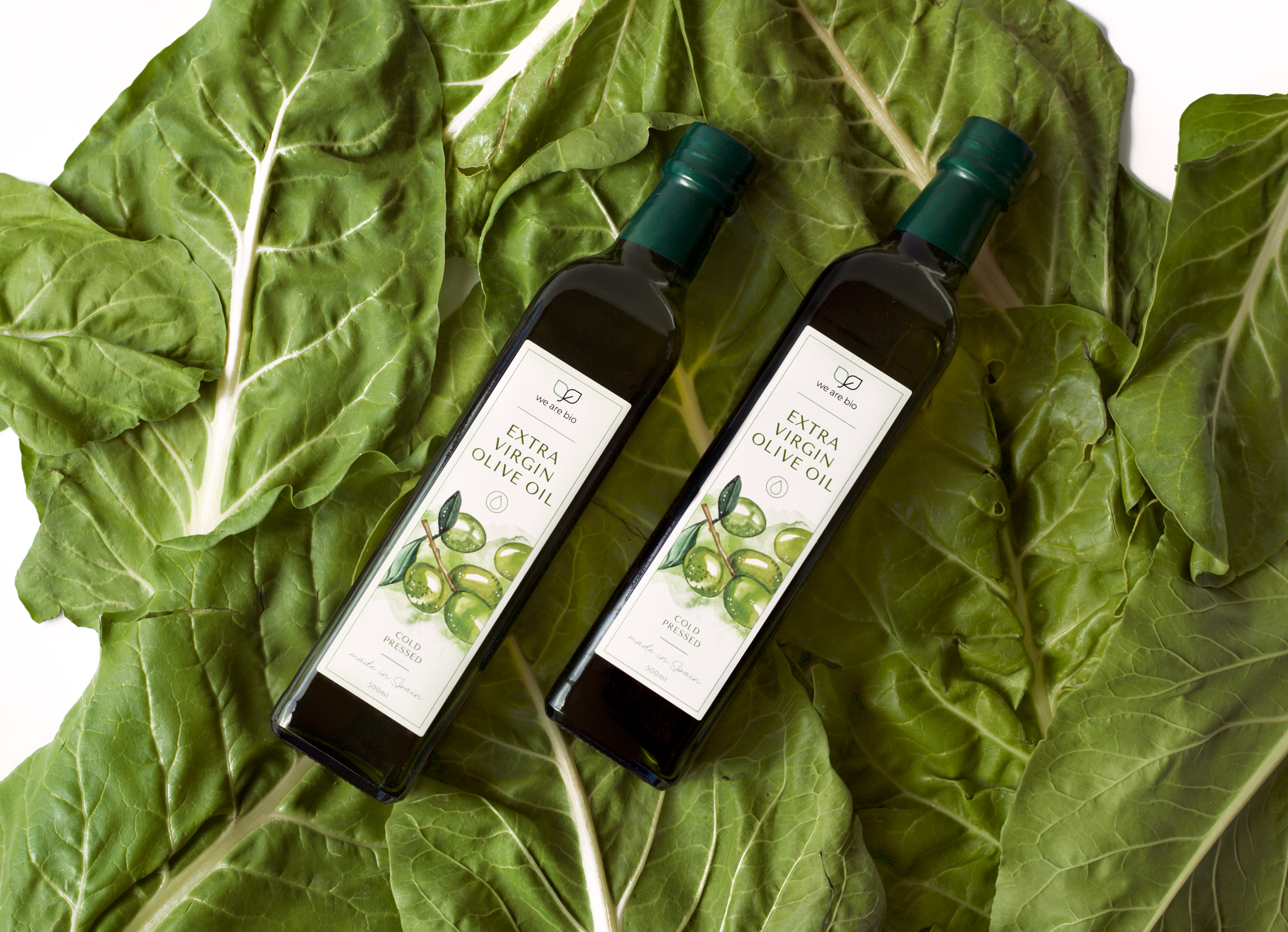 Olive oil bottles on mangold leaves