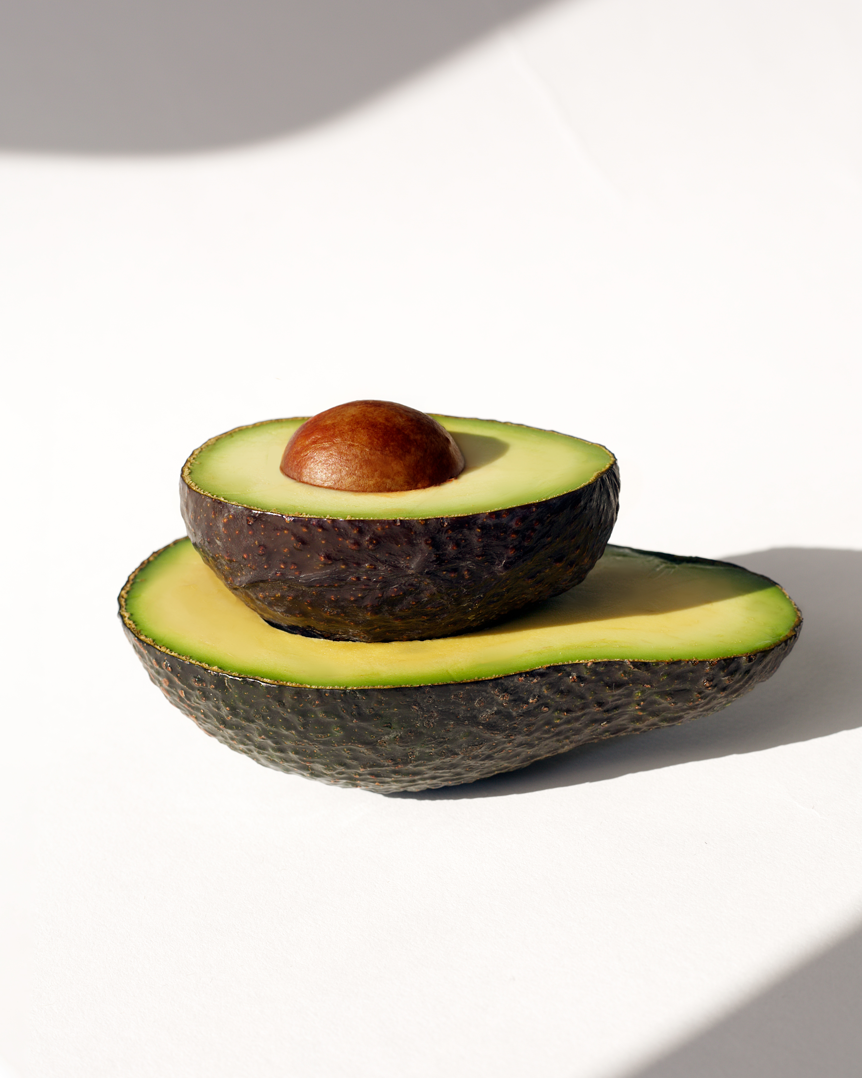 A bottle and its label under lab light, inspected before it leaves the house